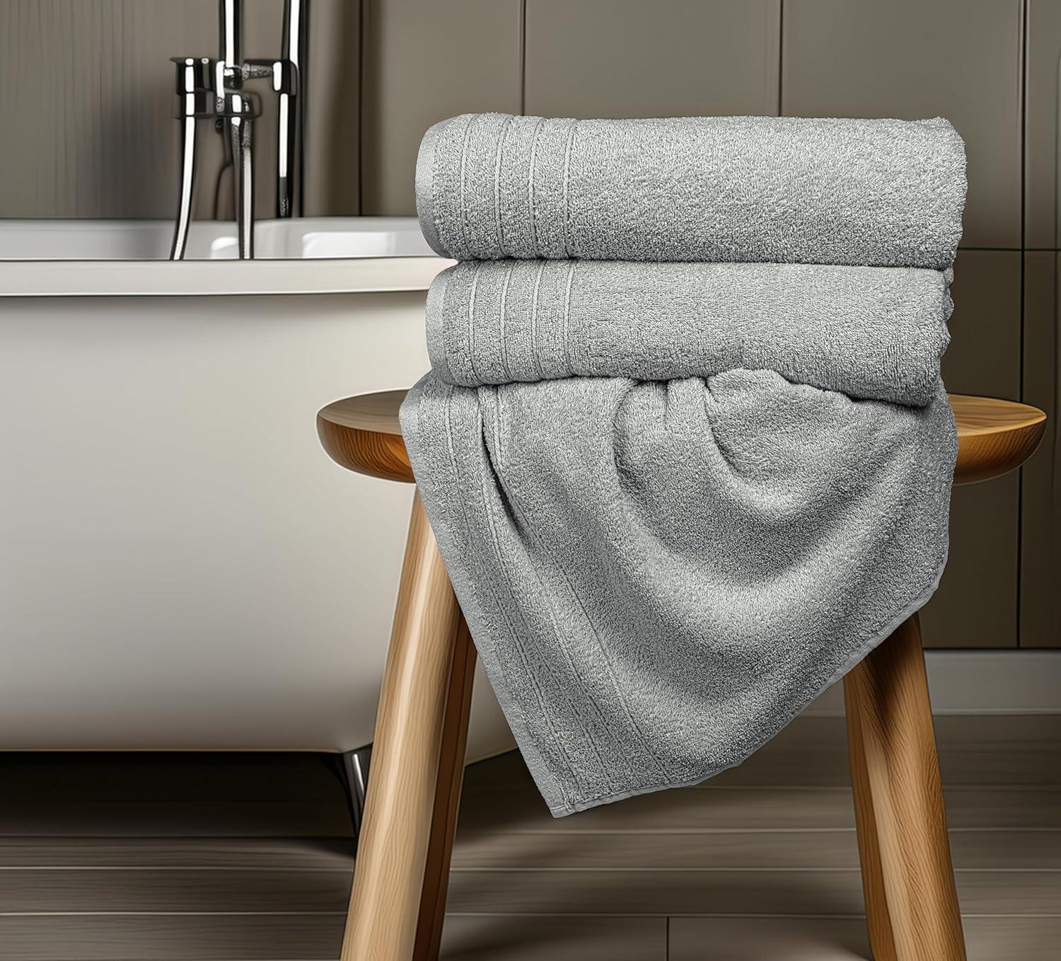 imageTens Towels Pack of 4 Extra Large Bath Towels 30 x 60 Inches 100 Cotton Larger ampamp Lighter Weight Quicker to Dry Super Soft and Absorbent Perfect for Bathroom Dark GreyCool Grey